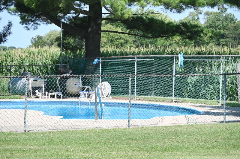 Mesh Fence with Pool in Background